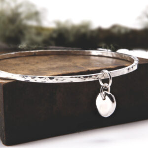 Molten silver charm hammered bangle – square