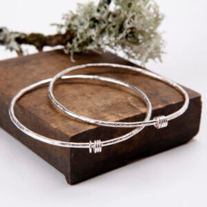 Textured silver bangles with sterling silver rings