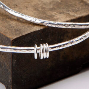 Textured silver bangles with sterling silver rings